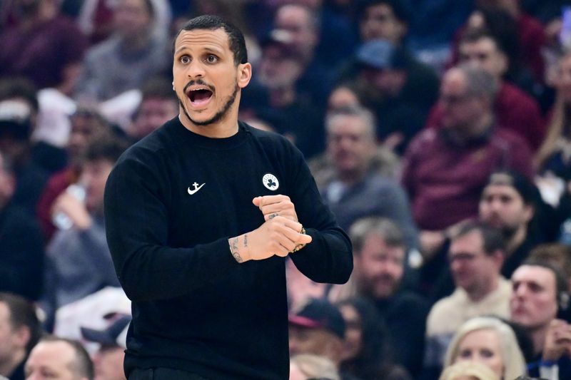 Mar 8, 2026; Cleveland, Ohio, USA; Boston Celtics head coach Joe Mazzulla reacts during the first quarter against the Cleveland Cavaliers at Rocket Arena. Mandatory Credit: Ken Blaze-Imagn Images
