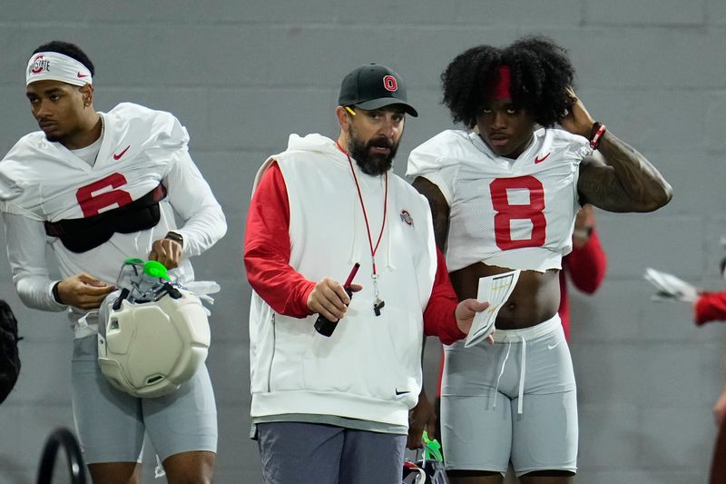 Ohio State Buckeyes defensive coordinator Matt Patricia talks to safety Jaylen McClain (8) during the first day of spring workouts for the 2026 football season at Woody Hayes Athletic Complex in Columbus on March 10, 2026.