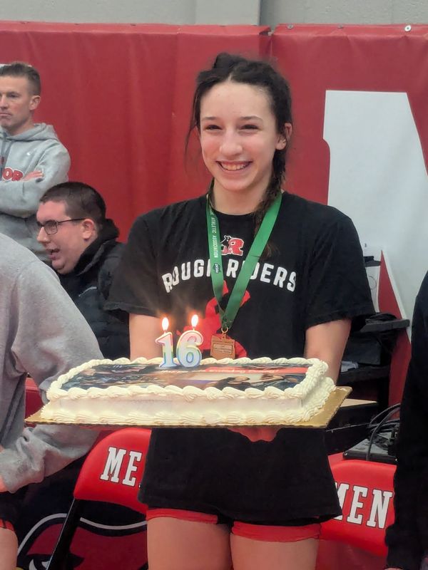 Roosevelt's Penny Edwards with her third-place medal at the Mentor district tournament.