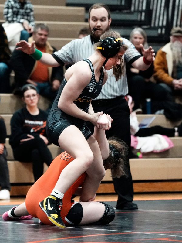 Tri-Valley's Kandice Spry, top, wrestles at 115 pounds during the Scotties' dual match against New Lexington on Feb. 5, 2026, at New Lexington High School. Spry will wrestle in the Division I state tournament Feb.. 13-15 at Ohio State's Value City Arena in Columbus.