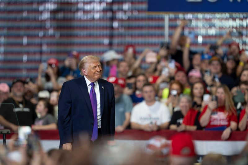 President Donald Trump steps away from the podium before leaving at a political rally held at Verst Group Logistics in Hebron, Kentucky, on Wednesday, March 11, 2026.