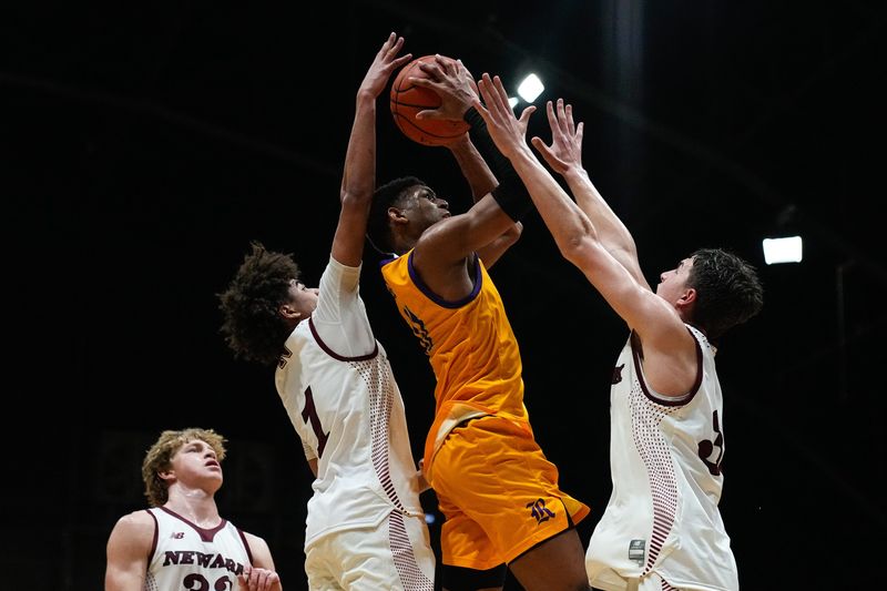 Reynoldsburg's Xavier McKinney (11) shoots the ball against Newark in the second half of the OHSAA regional semifinal game at Taft Coliseum on Wednesday, March 11, 2026 in Columbus, Ohio.