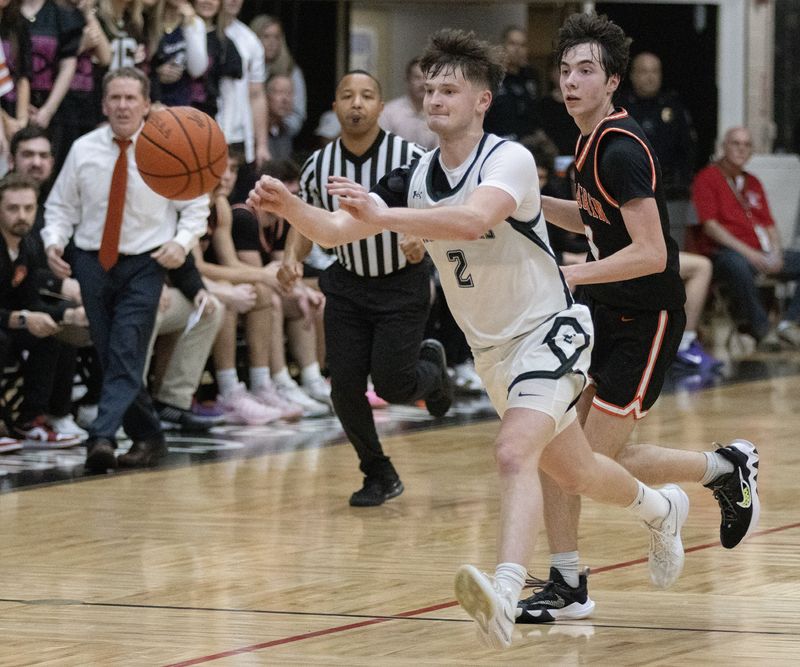 Central’s Dylan Minnie brings the ball down court against Chargin Falls during a Division V regional semifinal Wednesday, March 11, 2026. Bob Rossiter / Special To The Canton Repository