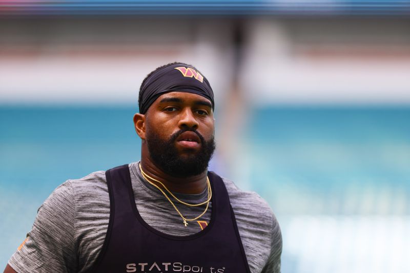 Aug 17, 2024; Miami Gardens, Florida, USA; Washington Commanders defensive tackle Jonathan Allen (93) warms up before a preseason game against the Miami Dolphins at Hard Rock Stadium. Mandatory Credit: Sam Navarro-USA TODAY Sports
