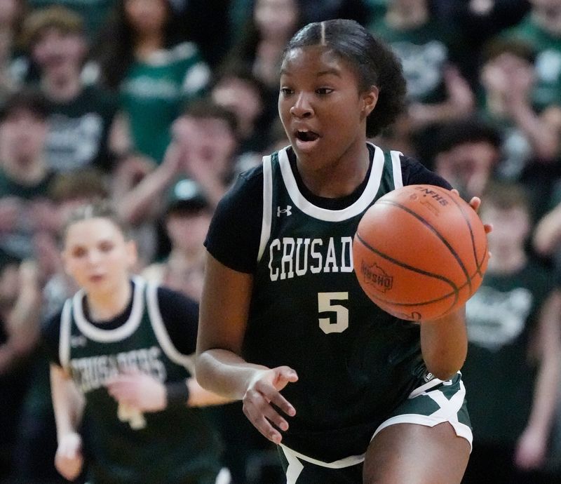 Canton Central Catholic’s Aubrey Harris-Hall (5) drives against Margaretta in the girls basketball Div. VI state semifinal game at the Wright State University Nutter Center in Dayton on March 12, 2026.
