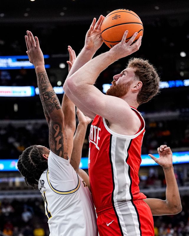 Ohio State forward Brandon Noel (14) makes a jump shot against Michigan guard Roddy Gayle Jr. (11) during the first half of Big Ten tournament quarterfinal at United Center in Chicago on Friday, March 13, 2026.