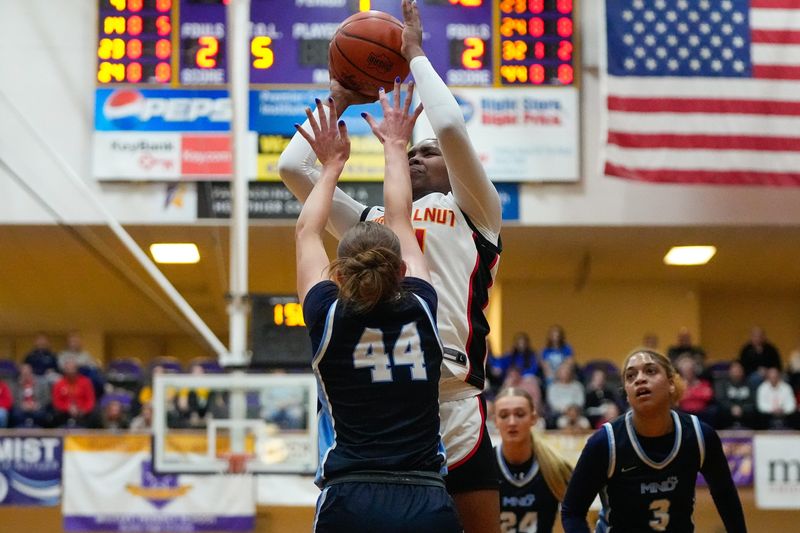 Big Walnut's Sydney Mobley shoots the ball against Mount Notre Dame's Reece Hackney during a Division I state semifinal March 13.