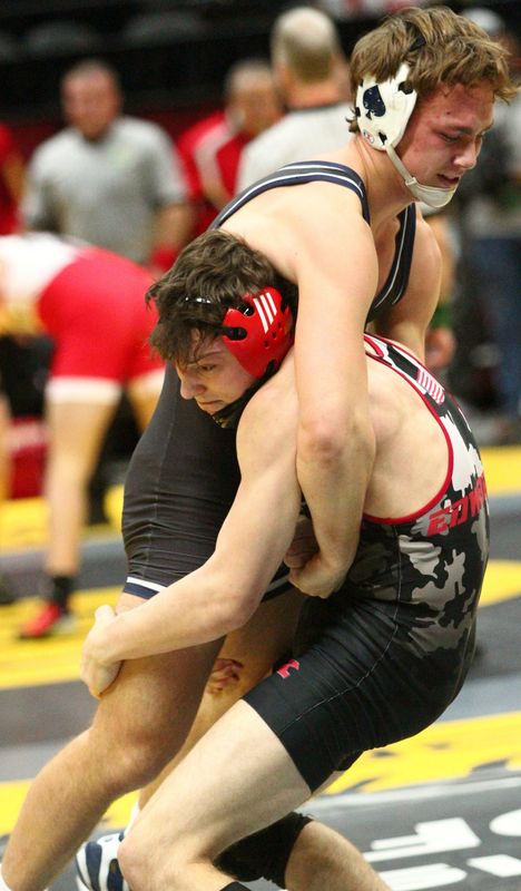 Granville's Luke Sanchez wrestles Kent Roosevelt's Gavin Edwards in a 165-pound match on March 13.