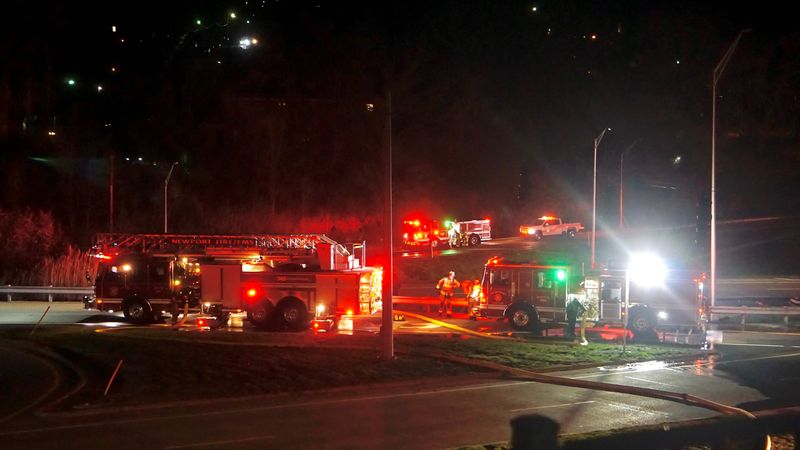 Fire crews are at the scene of a large fire on I-471 near the Memorial Parkway exit in Newport late Friday, March 13, 2026.