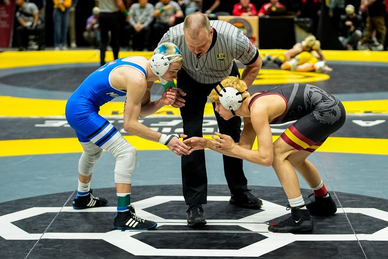 Southeast’s Damian Kemble wrestles Miami East’s Spencer Shore in the 120-pound class during the DIII state wrestling tournament at Value City Arena, March 14, 2026, in Columbus, Ohio.