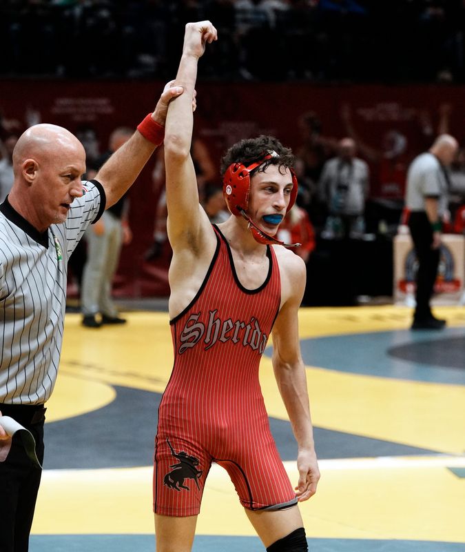 Cash Owen, of Sheridan, greets the crowd after winning his quarterfinal match t 113 pounds during the Division II state tournament on Saturday, March 14, 2026, at Ohio State's Value City Arena.