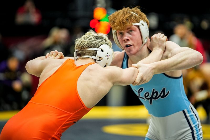 Louisville’s Kaiden Barker, right, wrestles Ashland’s Mason Bauer in the 138-pound class during the DI state wrestling tournament at Value City Arena, March 15, 2026, in Columbus, Ohio.
