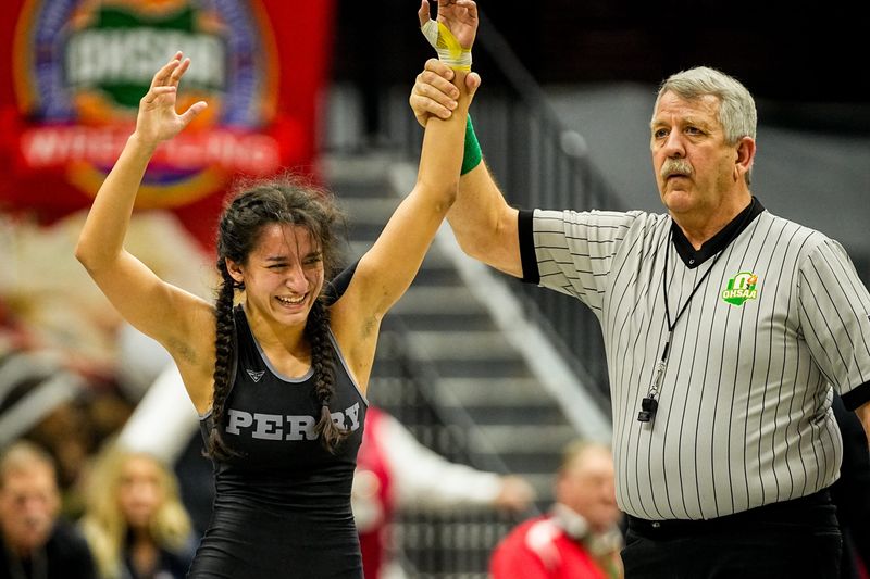 Perry’s Mia Forberg celebrates defeating Walsh Jesuit’s Isabella Theil in the 106-pound class during the girls state wrestling championships, March 15, 2026, in Columbus.
