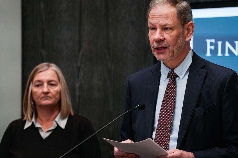 Steve Imm, Theetge's attorney, and former Chief Teresa Theetge are pictured here in press conference in March.