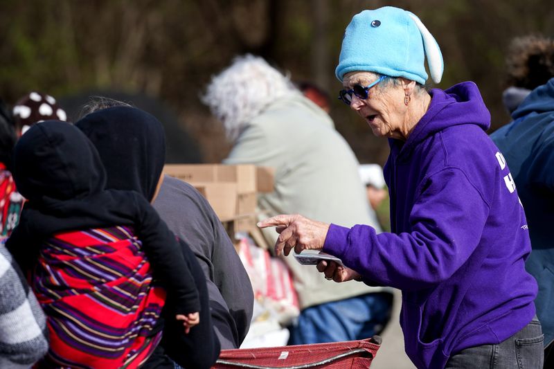 Nancy Sullivan, community organizer for Transformations, runs a pop-up food pantry most Friday afternoons in East Price Hill.