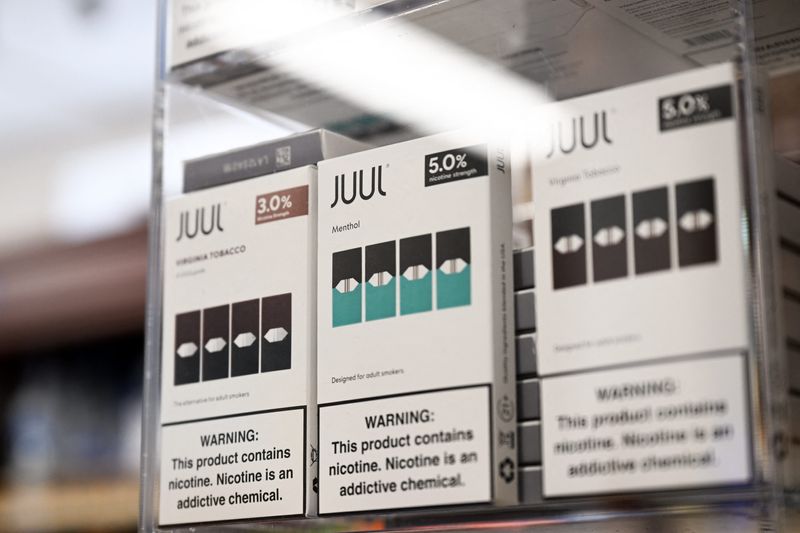 JUUL Labs Inc. Virginia tobacco and menthol flavored vaping e-cigarette products are displayed in a convenience store on June 23, 2022 in El Segundo, California. Vaping company Juul Labs said Thursday it would appeal a decision by the US Food and Drug Administration ordering all its products off the market, a move the agency said was based on safety concerns. (Photo by Patrick T. FALLON / AFP) (Photo by PATRICK T. FALLON/AFP via Getty Images)