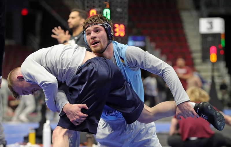 Kent State’s Chris Earnest wrestles his coach Devin Shroder before the NCAA Division I wrestling championships at Rocket Arena, March 18, 2026, in Cleveland, Ohio.