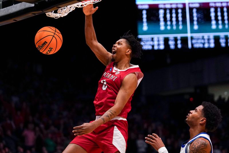 Miami (OH) RedHawks wing Eian Elmer (0) dunks the ball in the second half of the NCAA Tournament First Four game between the Miami Redhawks and Southern Methodist University Mustangs, Wednesday, March 18, 2026, at University of Dayton Arena in Dayton, Oh. RedHawks won 89-79.