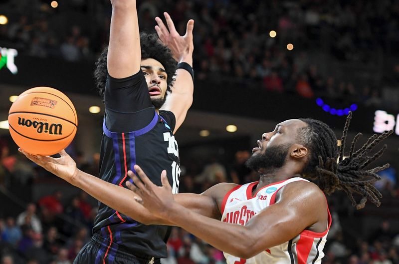 TCU Horned Frogs forward David Punch (15) defends the shot of Ohio State Buckeyes guard Bruce Thornton (2) Thursday, March 19, 2026, during the NCAA Menâ€™s Basketball Tournament first round game at Bon Secours Wellness Arena in Greenville, South Carolina.