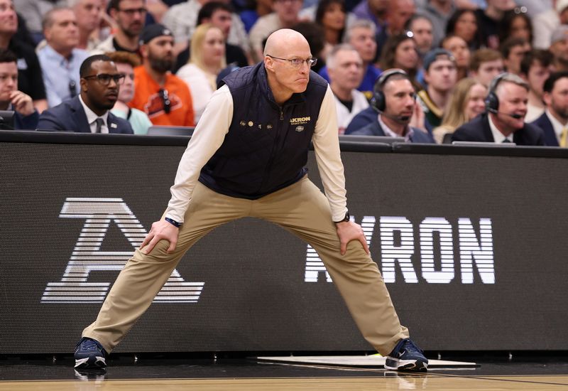Mar 20, 2026; Tampa, FL, USA; Akron Zips head coach John Groce in the first half against the Texas Tech Red Raiders during a first round game of the men's 2026 NCAA Tournament at Benchmark International Arena. Mandatory Credit: Matt Pendleton-Imagn Images
