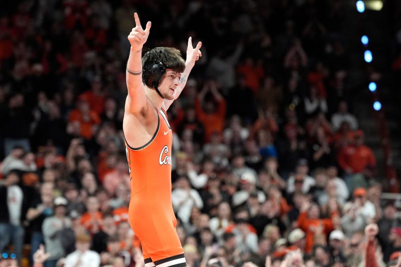 Oklahoma State's Jax Forrest celebrates as he defeats Iowa's Drake Ayala at 133 pounds during a college wrestling dual between the Oklahoma State University Cowboys (OSU) and the Iowa Hawkeyes at Gallagher-Iba Arena in Stillwater, Okla., Sunday, Feb. 22, 2026.
