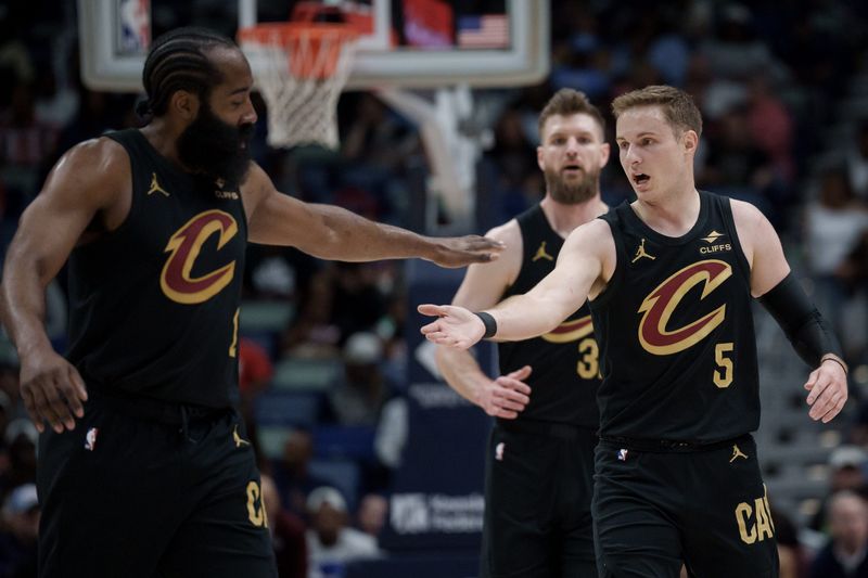 Mar 21, 2026; New Orleans, Louisiana, USA; Cleveland Cavaliers guard James Harden (1) celebrates with Cleveland Cavaliers guard Sam Merrill (5) during the first half against the New Orleans Pelicans at Smoothie King Center. Mandatory Credit: Matthew Hinton-Imagn Images