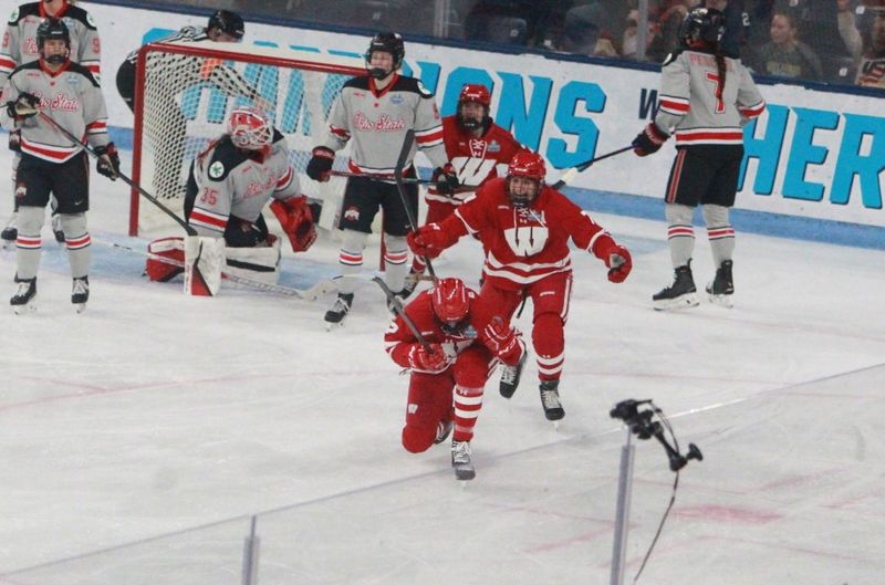 Wisconsin's Laney Potter takes a knee to celebrate after scoring a goal in the first period of the NCAA championship game versus Ohio State at Pegula Ice Arena in University Park, Pa. on Sunday March 22, 2026.