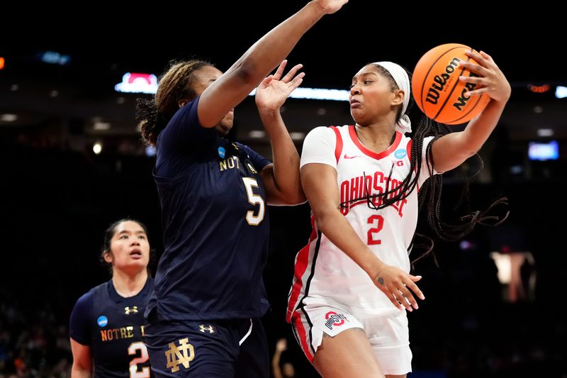 Ohio State guard Chance Gray passes around Notre Dame forward Malaya Cowles on March 23.