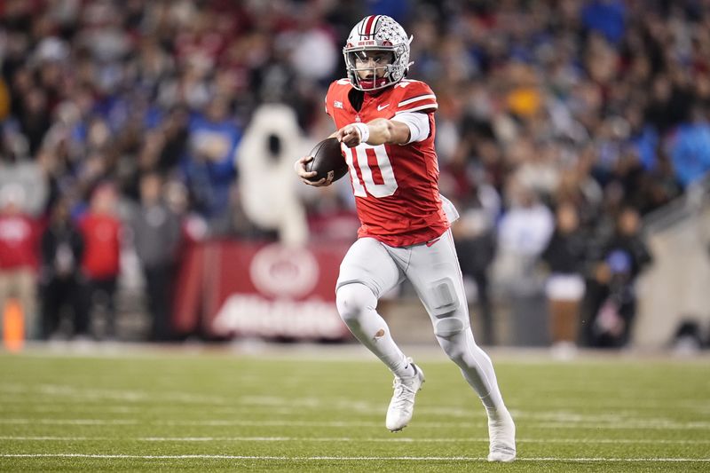 Ohio State Buckeyes quarterback Julian Sayin (10) runs during the NCAA football game against the UCLA Bruins at Ohio Stadium in Columbus on Nov. 15, 2025.