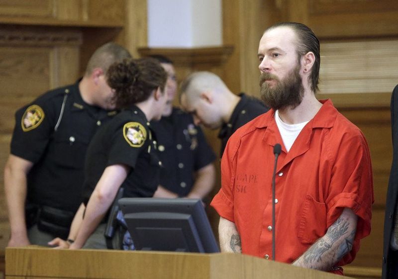 Anthony B. Grove pleads guilty in Stark County Common Pleas courtroom in 2015 as sheriff's deputies huddle behind him.