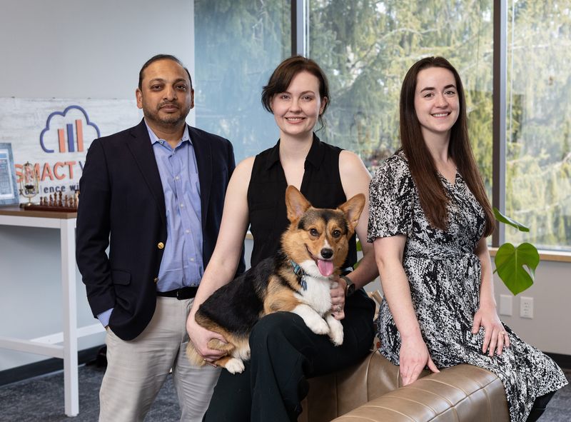 Founder and CEO Ranjith Yengoti, Rae Scherrer, Harry the corgi and Cecelia Glackin-Hunt at the SMACT Works office