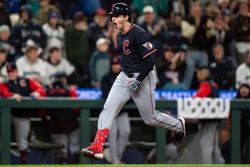 Mar 28, 2026; Seattle, Washington, USA; Cleveland Guardians designated hitter Chase DeLauter (24) celebrates while rounding the bases after hitting a two-run home run during the tenth inning against the Seattle Mariners at T-Mobile Park.