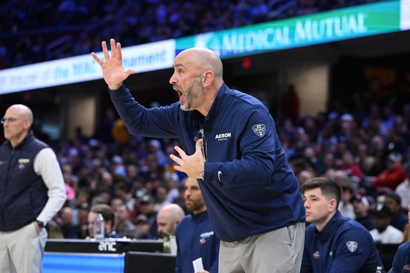 Dustin Ford coaches the University of Akron men's basketball team during the 2025-26 season.