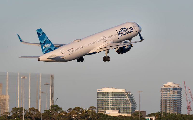 A JetBlue plane takes off at Palm Beach International Airport in West Palm Beach, Florida on February 7, 2025.