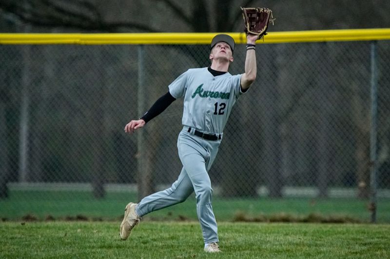 Aurora right fielder Drew Botos (12) tracks a popup during a game against Cuyahoga Falls, March 30, 2026, at Water Works Park in Cuyahoga Falls, Ohio.