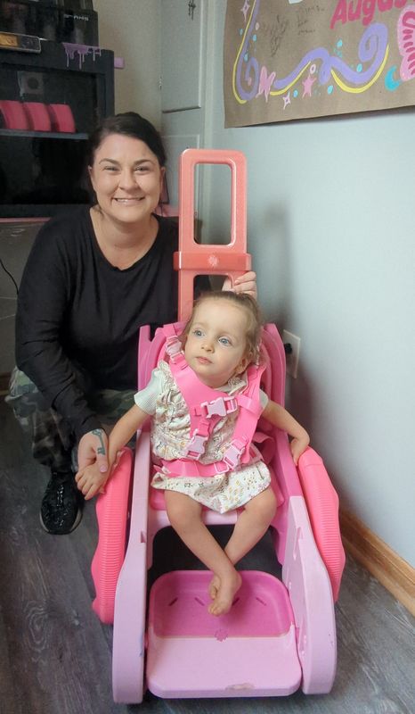Brittany Neal of North Canton used a 3D printer to craft an adaptive mobility device for her daughter Stormi, 3, who has a rare genetic disability. Using a free pattern she found online, Neal is making them for other families, too.