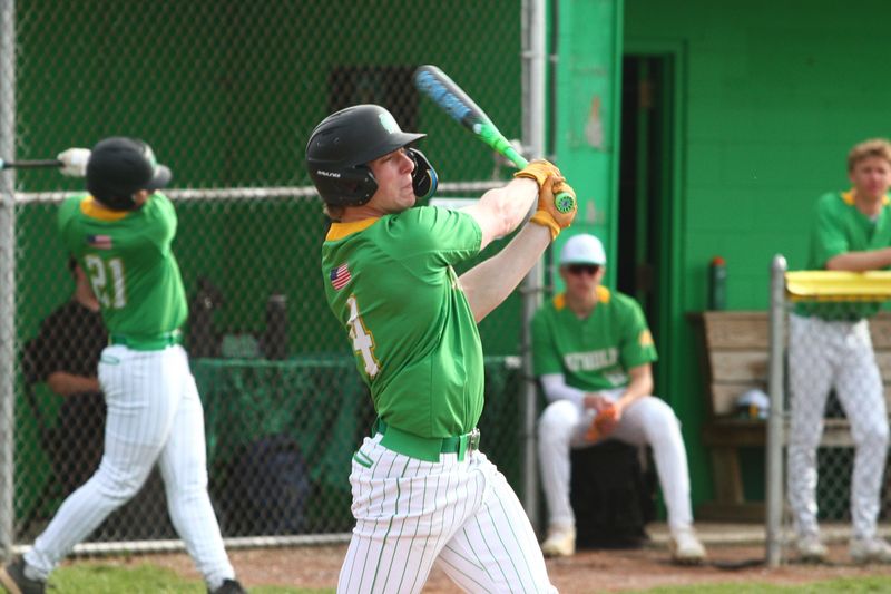 Newark Catholic's Kane Stephey hits during the Green Wave's 13-3 victory against visiting Granville Christian on March 31, 2026.