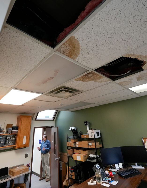 Administrative Assistant Ron Fields discusses the damage to the ceiling in the Ravenna Police Department IT area during a tour April 1, 2026.
