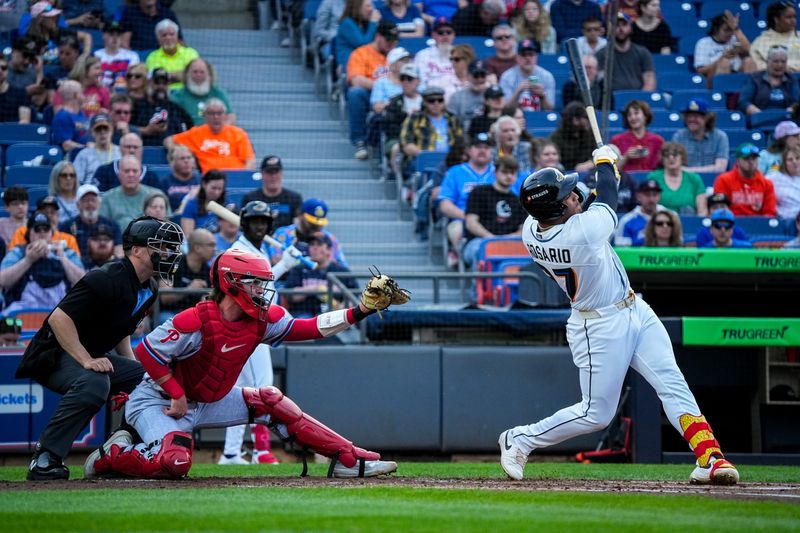 Akron outfielder Alfonsin Rosario (27) swings at a pitch during the home opening day game against Reading, April 2, 2026, in Akron, Ohio.