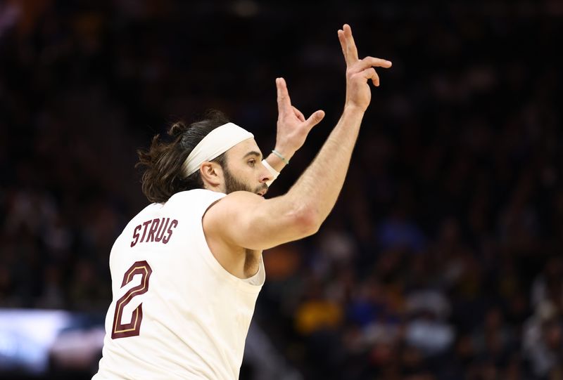 Cleveland Cavaliers forward/guard Max Strus (2) celebrates after making a late 3-pointer against the Golden State Warriors on April 2, 2026, in San Francisco, California.