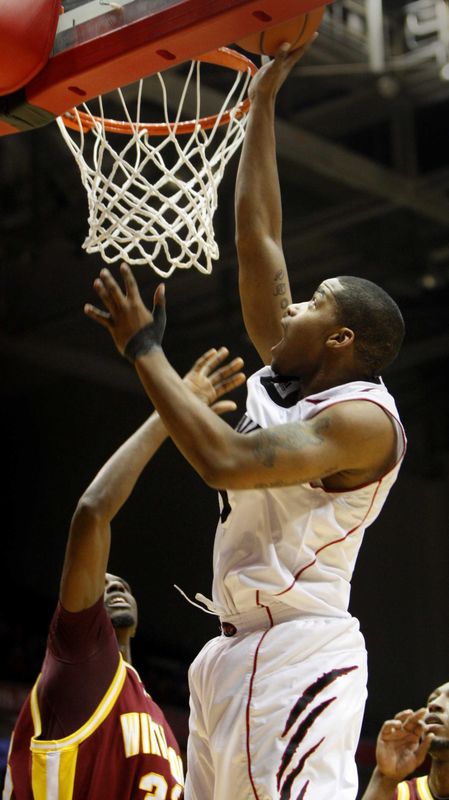 New Cincinnati Bearcats assistant coach Mantoris Robinson has played in Fifth Third Arena before. Here, in 2009, he defends Dion Dixon in a UC game vs. Winthrop.