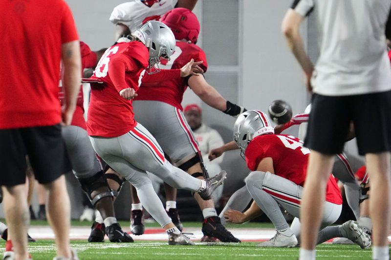 Ohio State's Connor Hawkins kicks a field goal during practice on April 4.