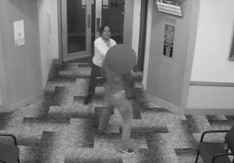 Security camera footage appears to show Kelli Johnson, former bailiff for Franklin County Juvenile and Domestic Relations Court Judge Monica Hawkins, smacking a cell phone out of a woman's hand during a March 24 altercation. Johnson resigned on March 30.