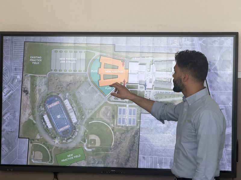 Architect Jonathan Imler shows a plan for an addition to Ravenna High School to the Ravenna Board of Education. The plan would house all students in the district in one building, with students in different grade levels housed in different wings.