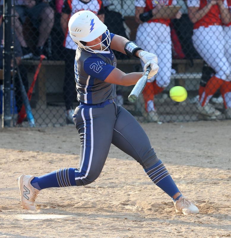 Lake’s Makenna Miller gets a hit in the third inning against Hoover at Hoover High. Thursday, April 9, 2026.