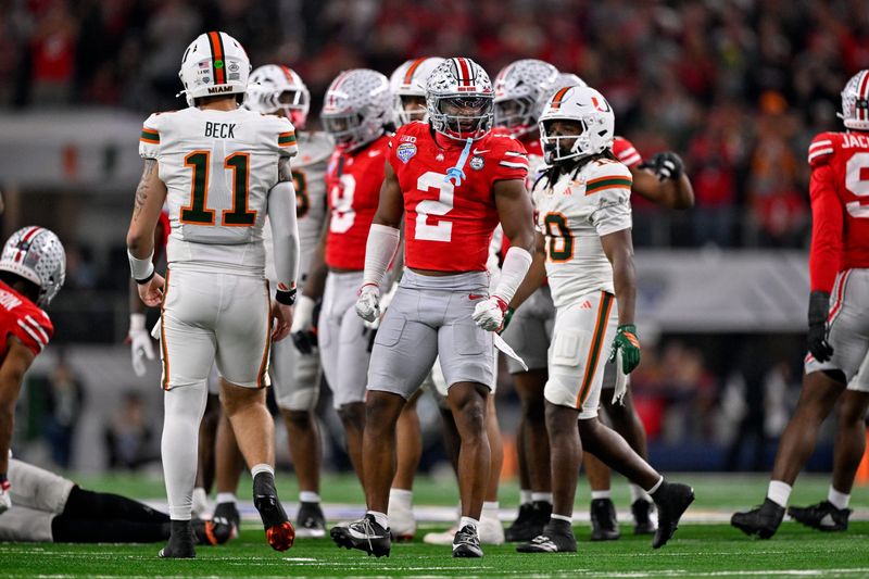 Dec 31, 2025; Arlington, TX, USA; Ohio State Buckeyes safety Caleb Downs (2) celebrates a defensive stop during the 2025 Cotton Bowl and quarterfinal game of the College Football Playoff at AT&T Stadium. Mandatory Credit: Jerome Miron-Imagn Images