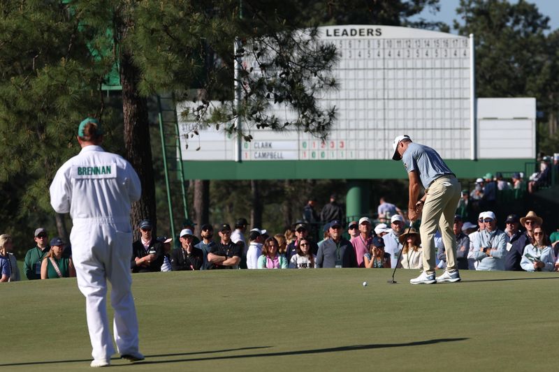 Corey Conners putts on the first green during the second round of the Masters Tournament at Augusta National Golf Club.