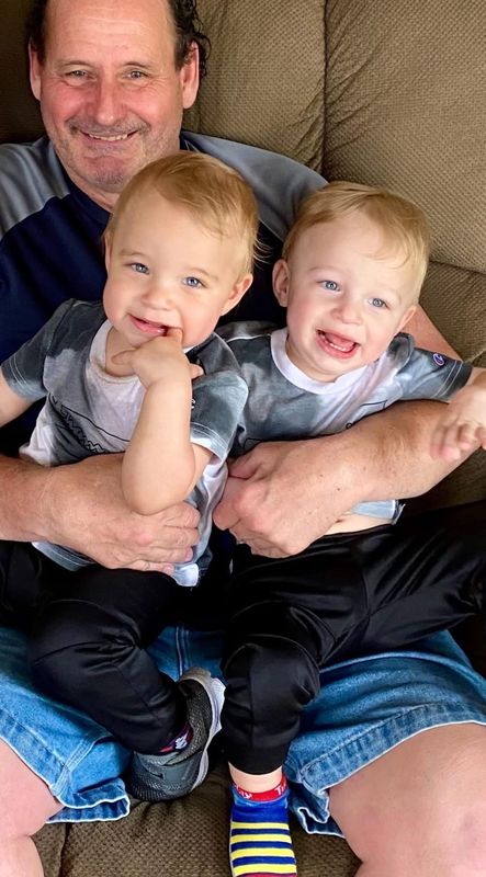In this 2022 family photo, Ed Grimsley has fun with his grandsons, Elias Kolsky, left, and Aksel Kolsky. Grimsley died last year at age 61. An exam of his brain revealed he suffered from the same brain disease as his brother, John Grimsley.