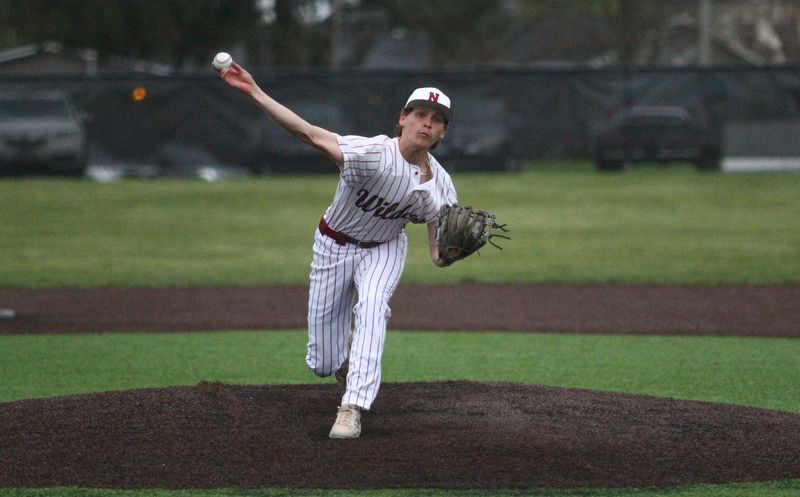 Newark's Moses Crane pitches during the Wildcats' 9-3 victory against visiting Canal Winchester on April 10, 2026.