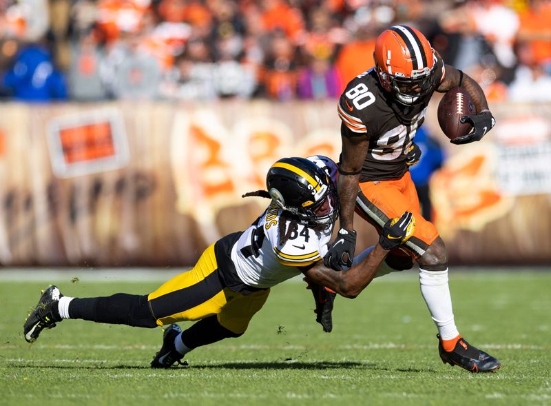 Oct 31, 2021; Cleveland, Ohio, USA; Cleveland Browns wide receiver Jarvis Landry (80) runs the ball out of bounds as Pittsburgh Steelers safety Terrell Edmunds (34) tackles him during the fourth quarter at FirstEnergy Stadium. Mandatory Credit: Scott Galvin-USA TODAY Sports
